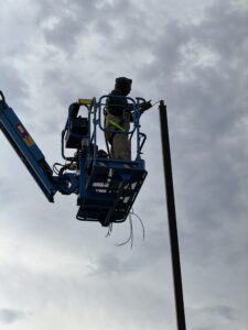 Laswell Electric team installing LED parking lot lights at Tru by Hilton, Shepherdsville, KY