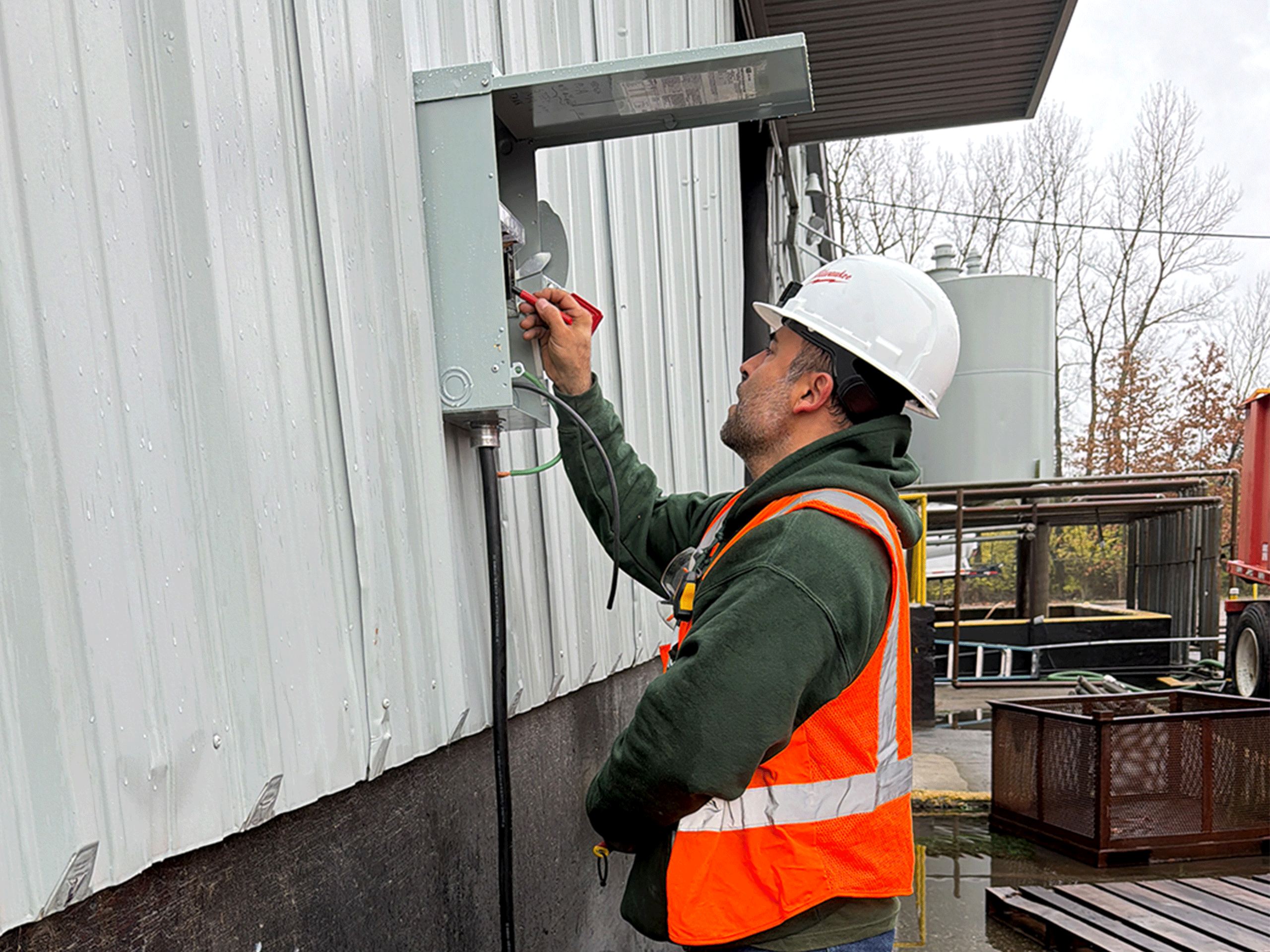 Laswell Electric electrician performing industrial electrical work at Midwest Environmental Services