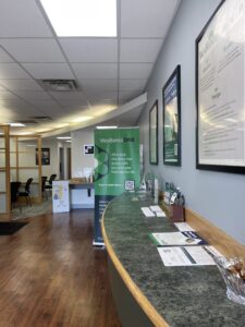 Interior of Wesbanco in New Albany, IN after Laswell Electric installed energy-efficient LED lighting, showing bright, modern banking spaces and improved visibility for staff and customers.