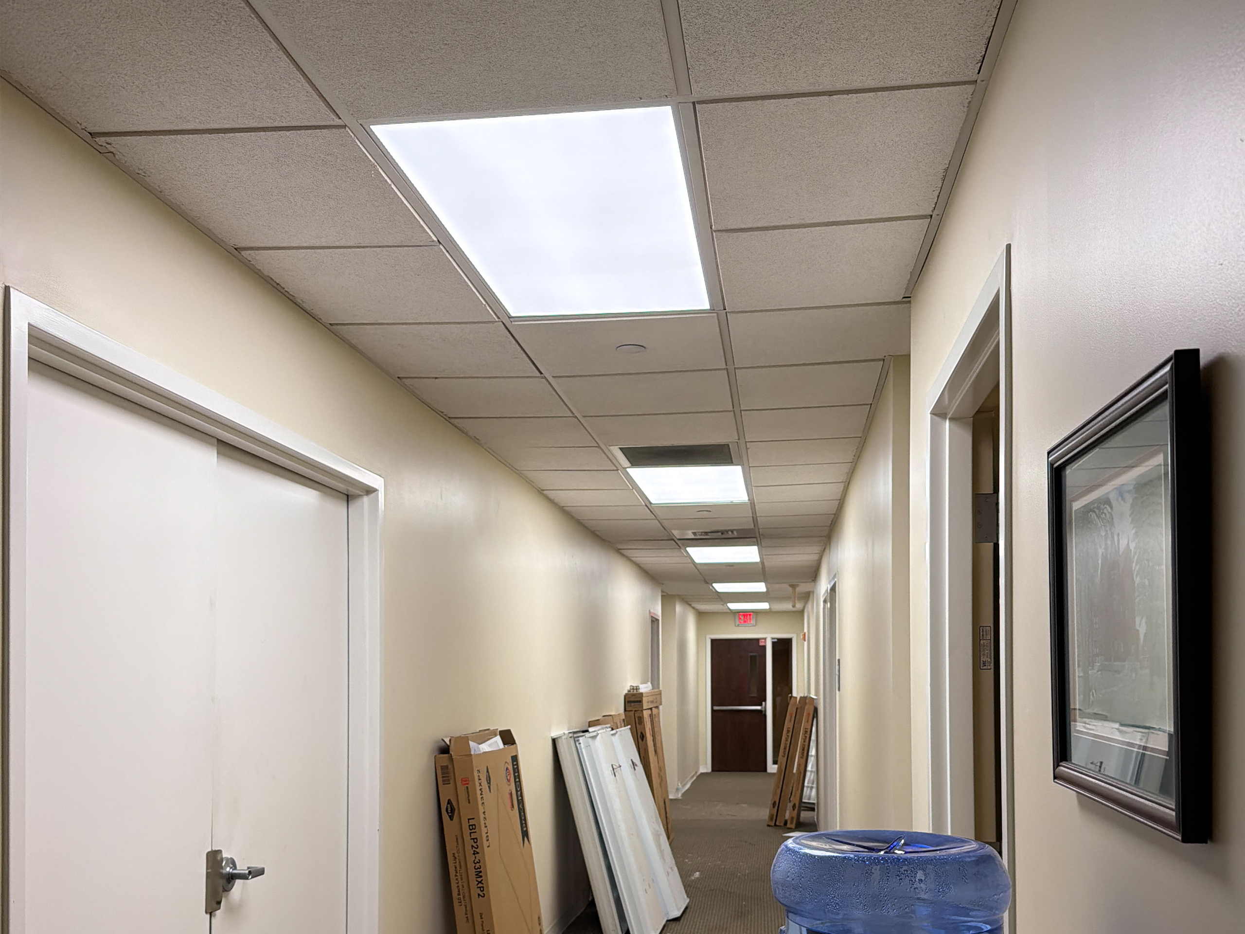 Commercial LED lighting retrofit completed by Laswell Electric at WesBanco in New Albany, IN showing upgraded energy efficient ceiling fixtures in a professional banking interior.